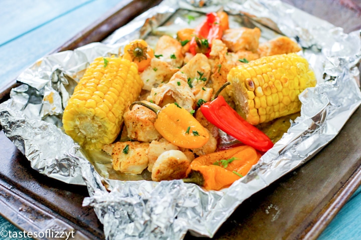 chicken, peppers and corn on foil