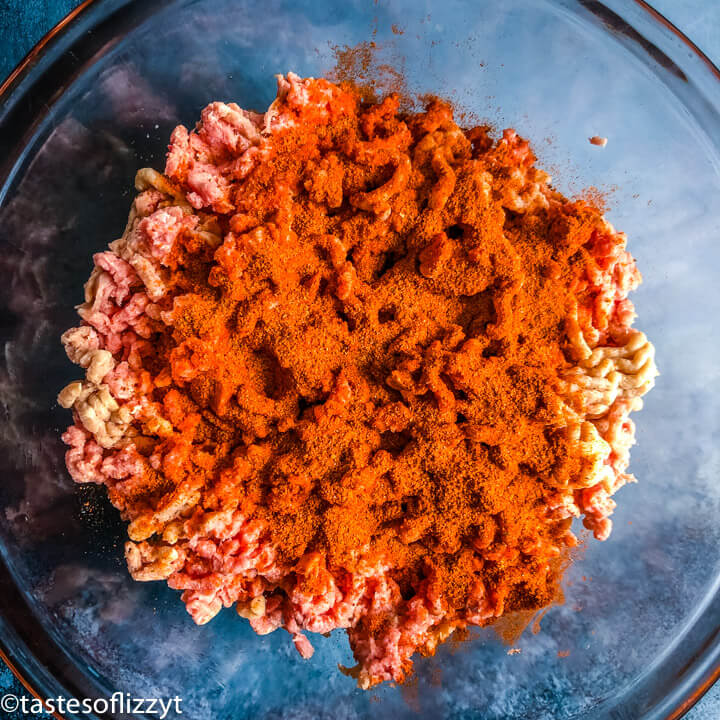 seasoning over ground turkey in a bowl