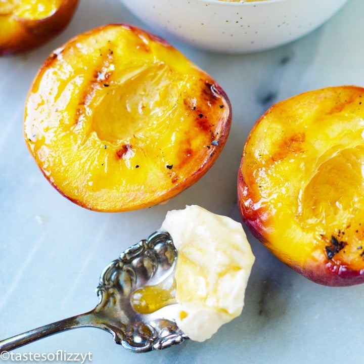 grilled peaches and spoon with cream