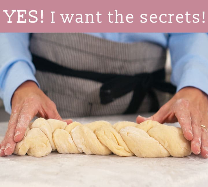 hands forming braided dough