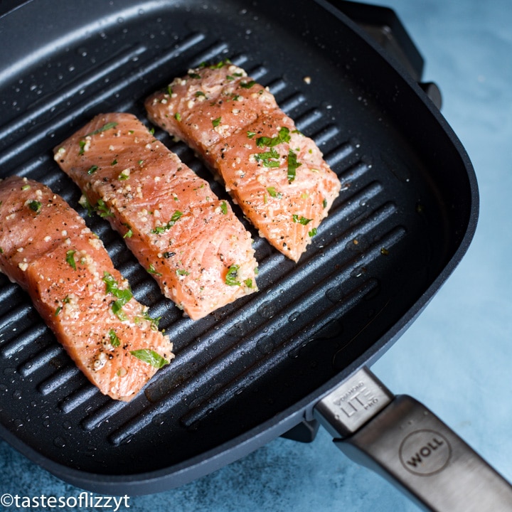 A close up of salmon on a grill