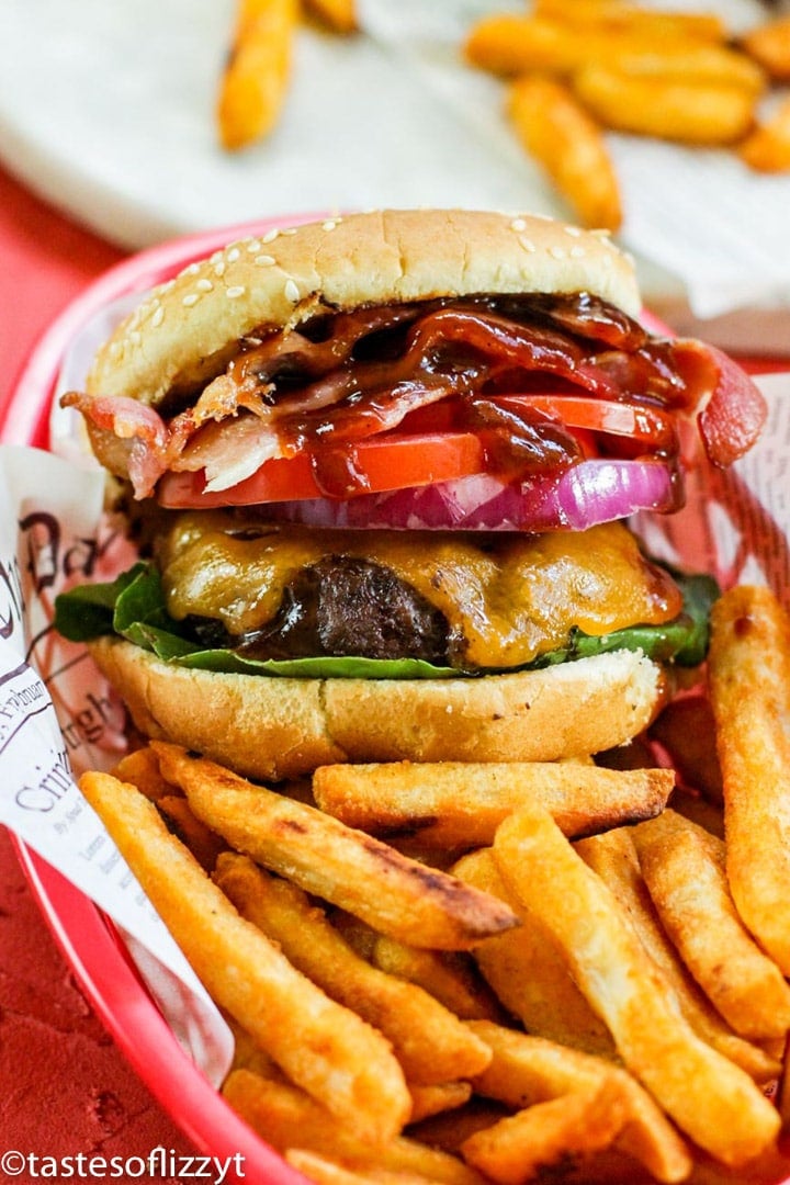 A sandwich sitting on top of a pile of fries