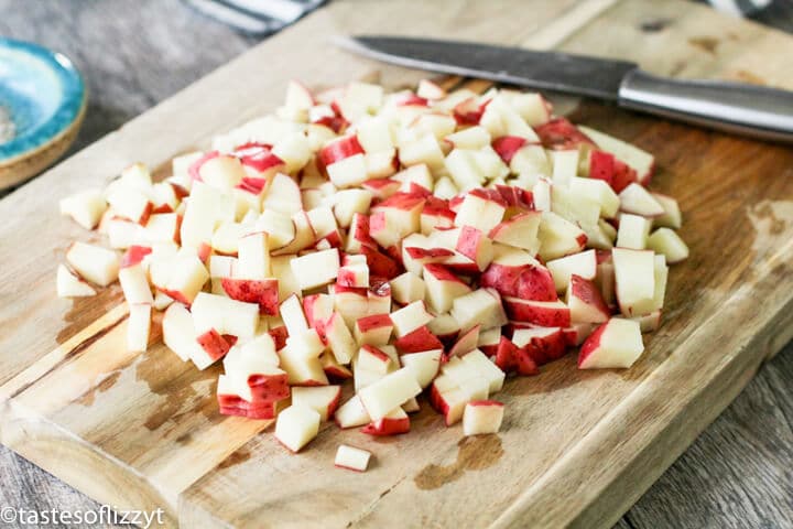 potatoes on a wooden cutting board