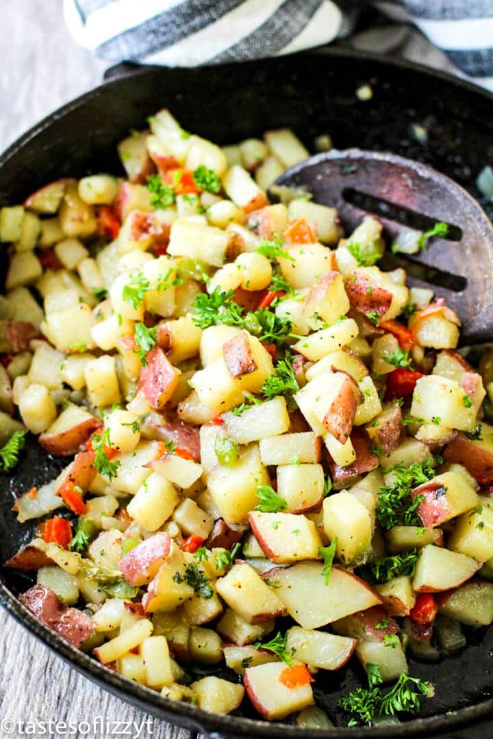 A pan filled with food, with Potatoes O\'Brien