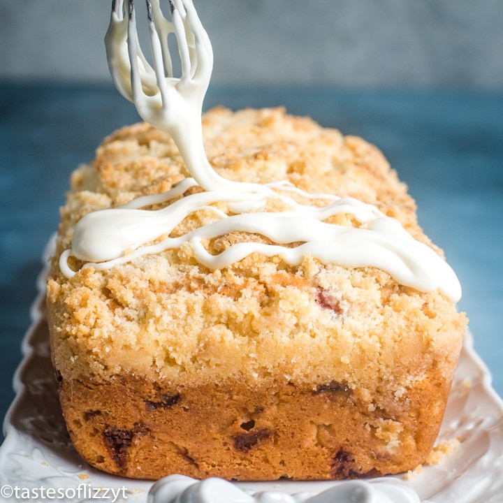 glaze drizzling on strawberry rhubarb bread