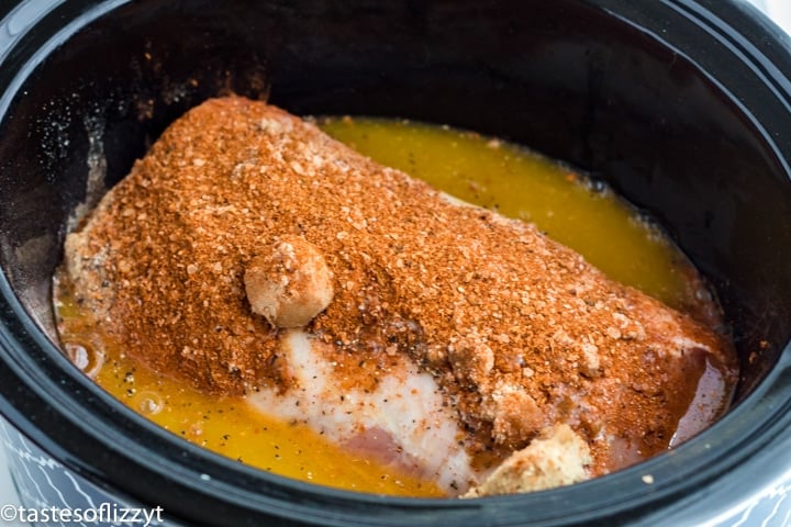 uncooked pork loin in a slow cooker