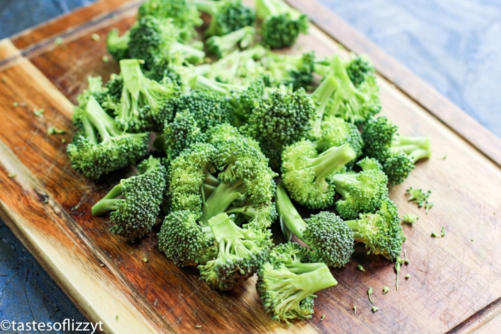 pieces of broccoli on a cutting board