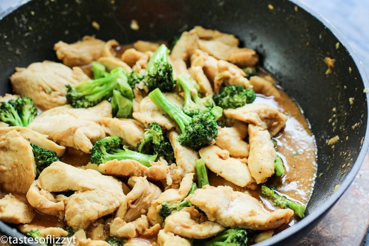 A skillet of food with broccoli, with Chicken and Stir frying