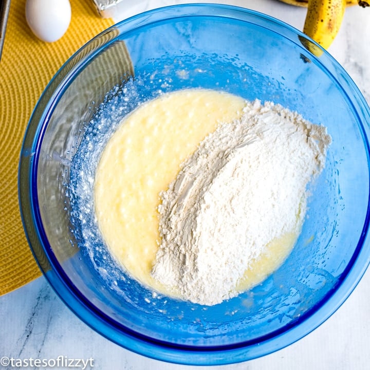adding dry ingredients to bread batter