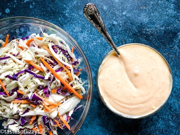 a bowl of coleslaw and sauce