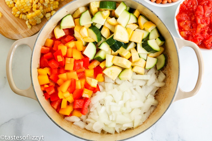 A pan of squash, peppers and onions