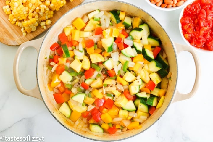 A pan of squash, peppers and onions