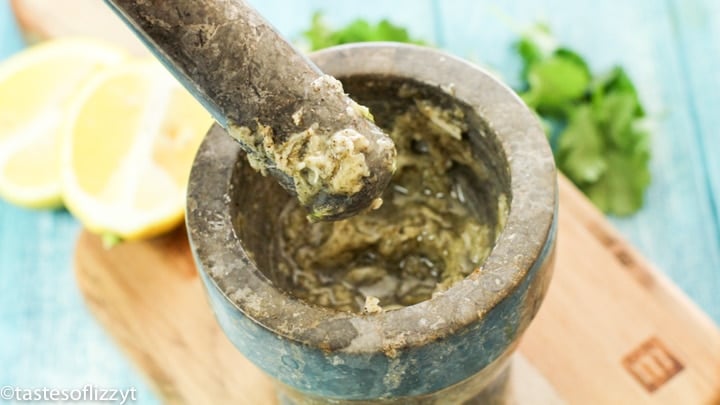 garlic and herbs crushed in bowl