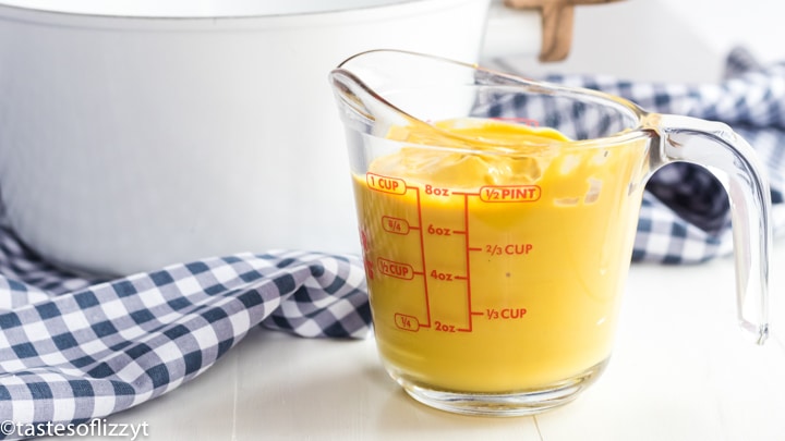 mustard in a measuring cup