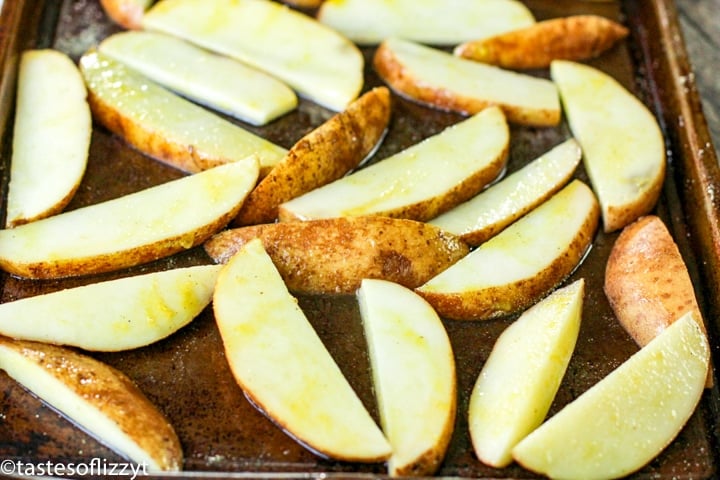 potato wedges on a baking sheet