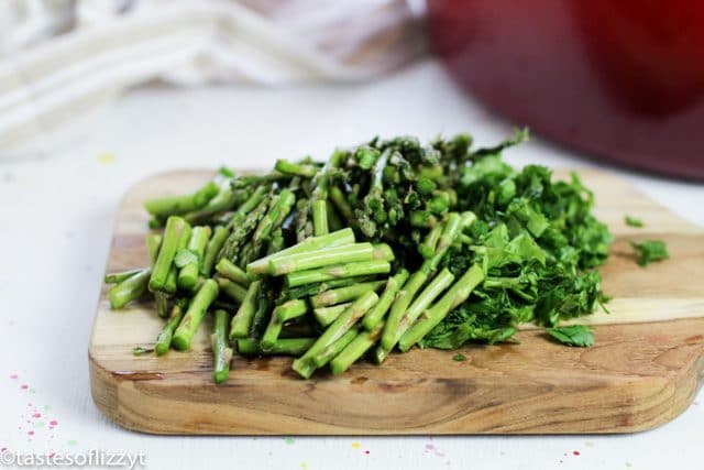 pieces of asparagus on a cutting board