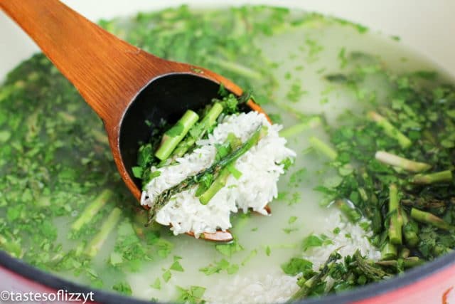 pot of water with rice and asparagus in pot