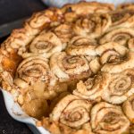 Cinnamon Roll Apple Pie with slice out