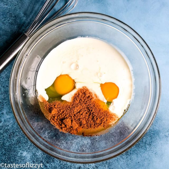 eggs, milk and cinnamon in mixing bowl unmixed