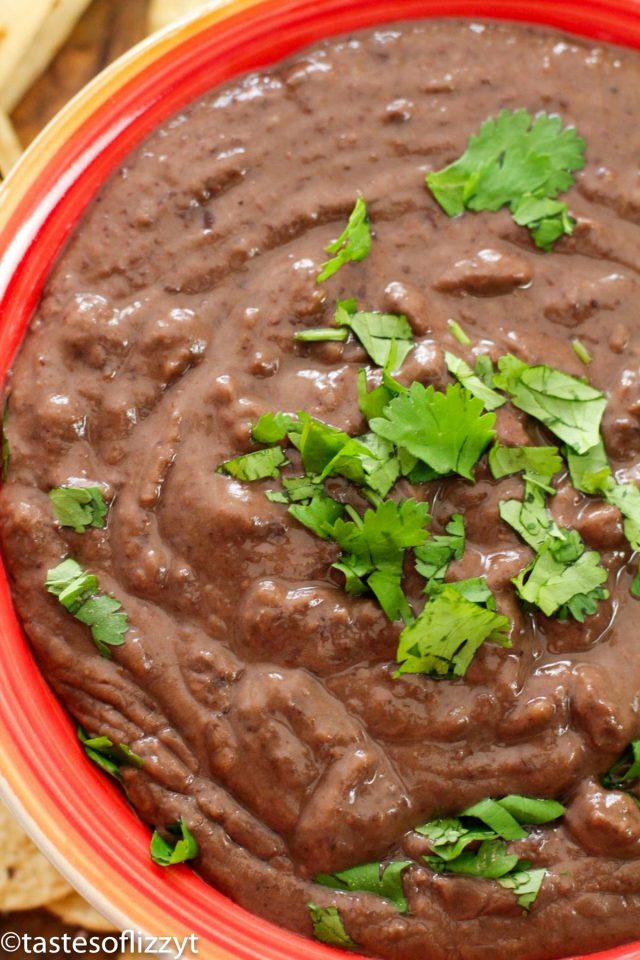 bowl of refried beans with cilantro