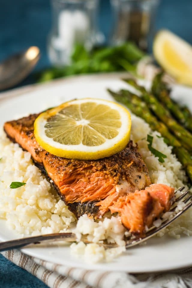 A plate of salmon with cauliflower rice