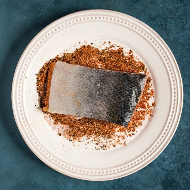 seasoning a salmon filet before frying