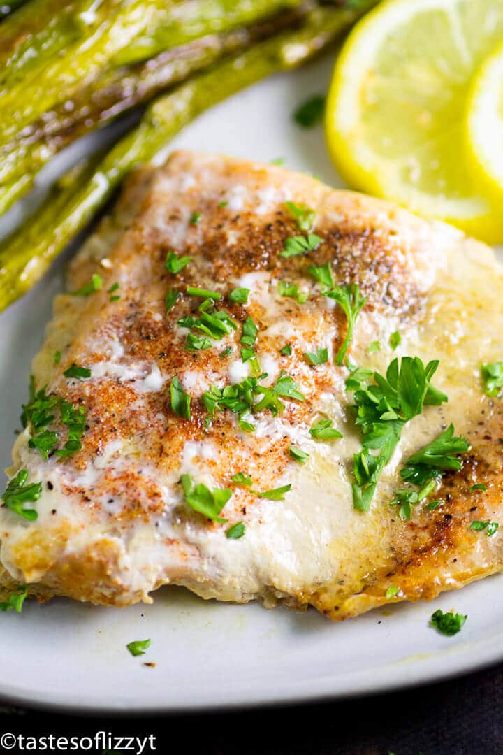 A close up of food on a plate, with Salmon and Lemon