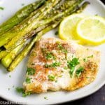 Lemon Garlic Butter Salmon with lemon slices and asparagus