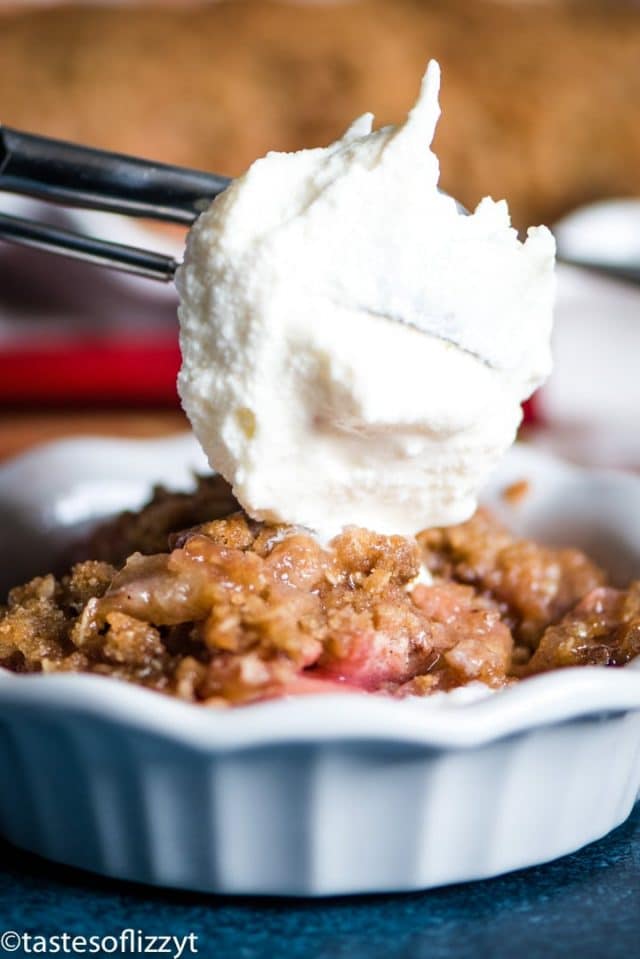 A close up of a rhubarb crumble with ice cream