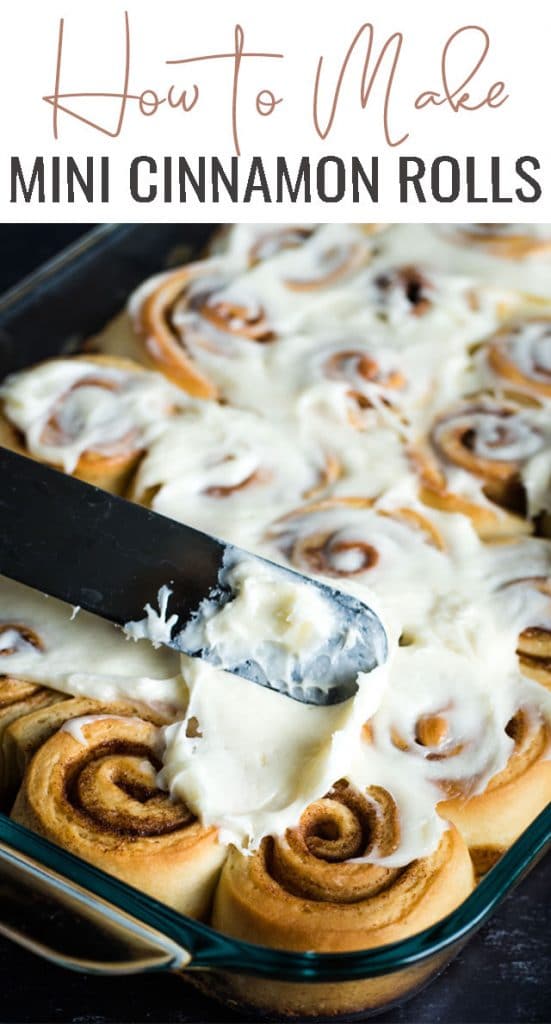 spreading frosting on cinnamon rolls