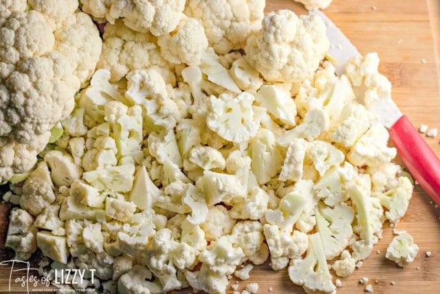 A close up of cauliflower on cutting board