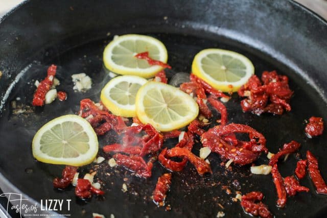 sun dried tomatoes and lemons in a skillet