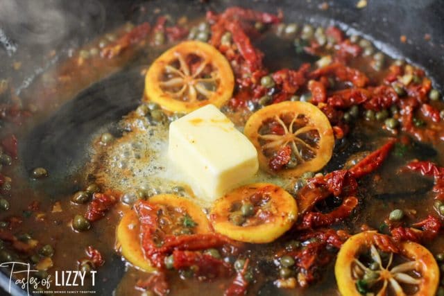 lemons, butter and tomatoes in a skillet