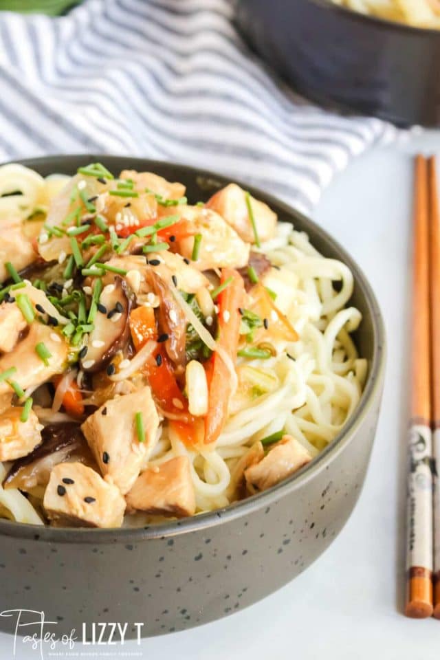 A bowl of food, with Chicken and Chop suey