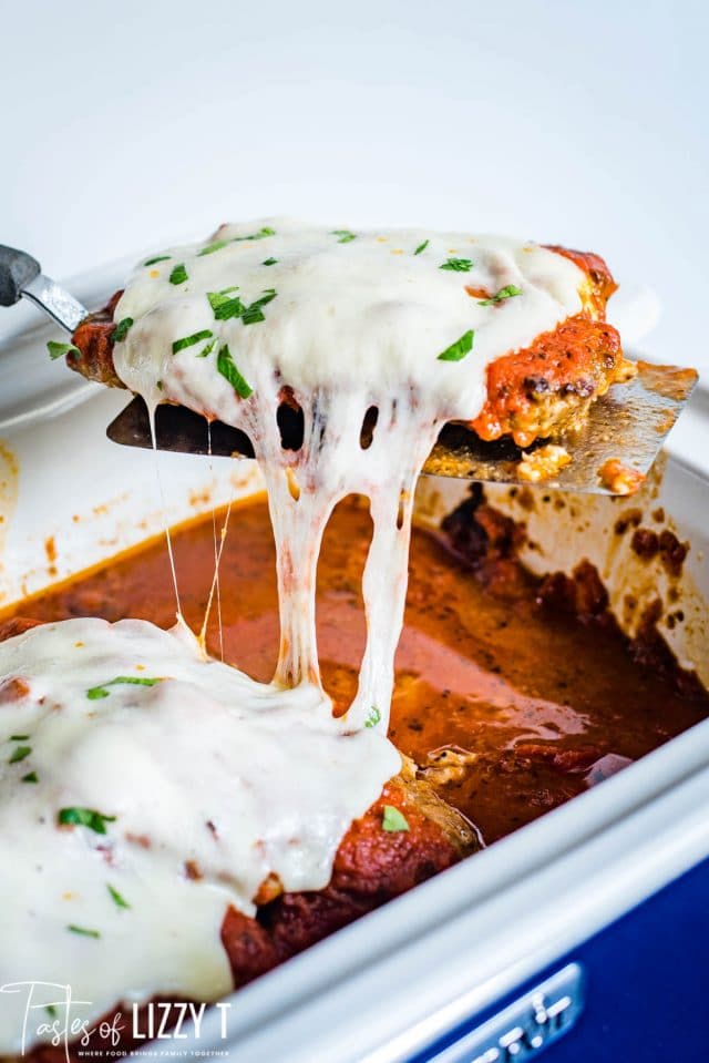 cube steak on a spatula with cheese