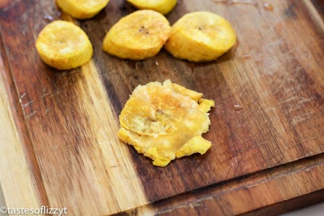 mashed plantains on cutting board