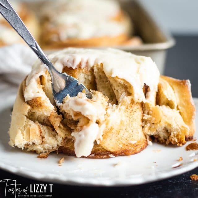 cinnamon roll with fork bite