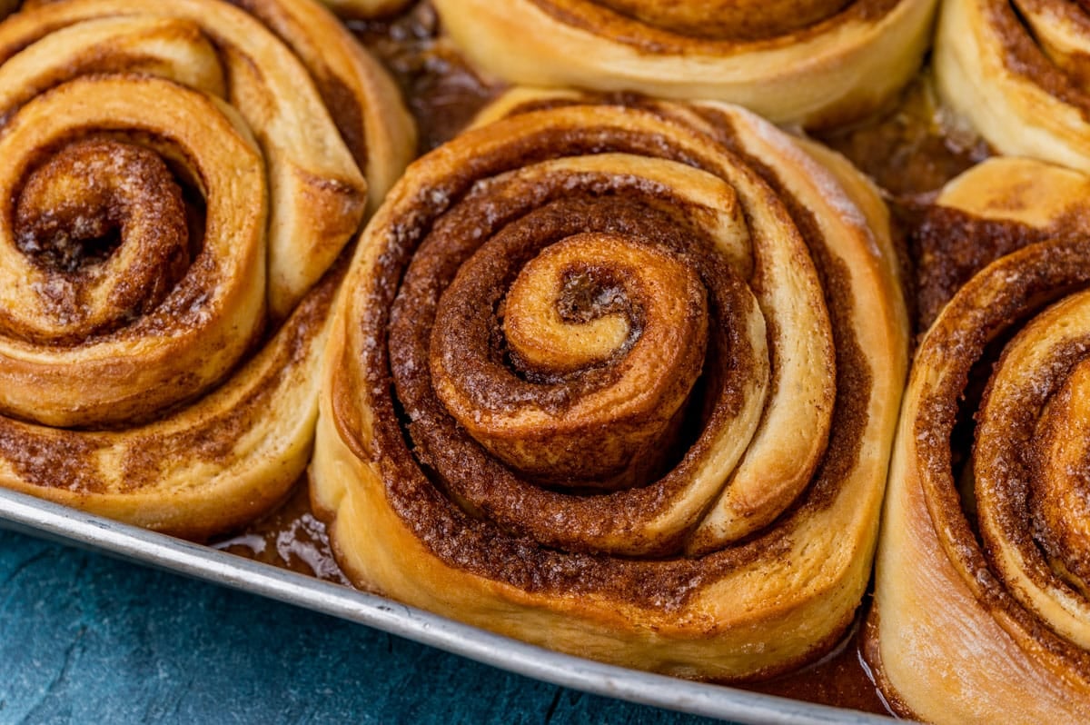 closeup of giant cinnamon rolls in a pan