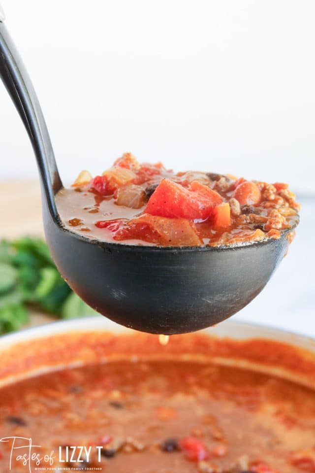 pumpkin chili in a ladle