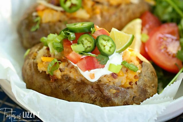 Warm baked potatoes meets tacos in this Mexican twice baked potatoes recipe that is the perfect twist on a Taco Tuesday!