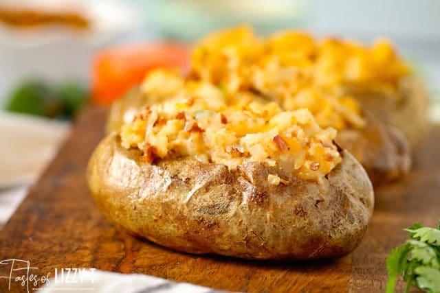 Warm baked potatoes meets tacos in this Mexican twice baked potatoes recipe that is the perfect twist on a Taco Tuesday!