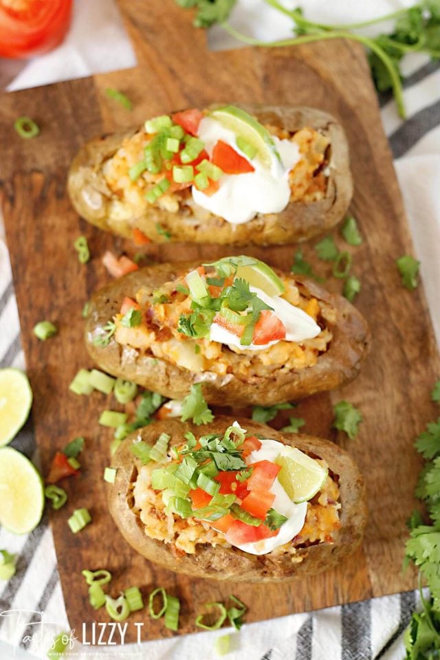 Warm baked potatoes meets tacos in this Mexican twice baked potatoes recipe that is the perfect twist on a Taco Tuesday!