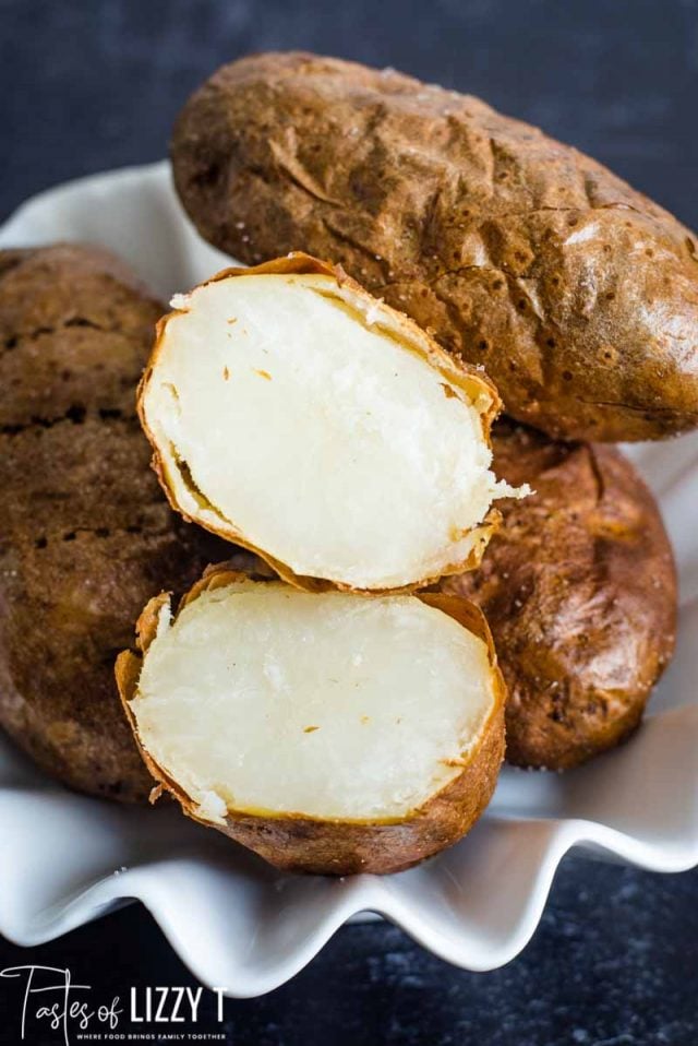 sliced open baked potato in a bowl