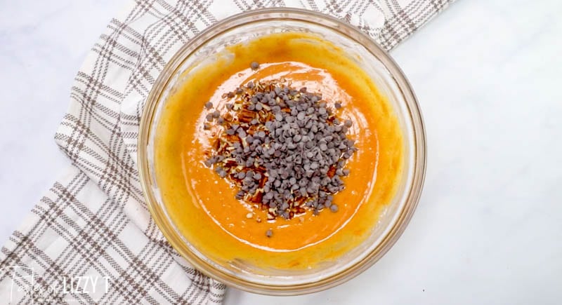 pumpkin batter in a bowl with chocolate chips