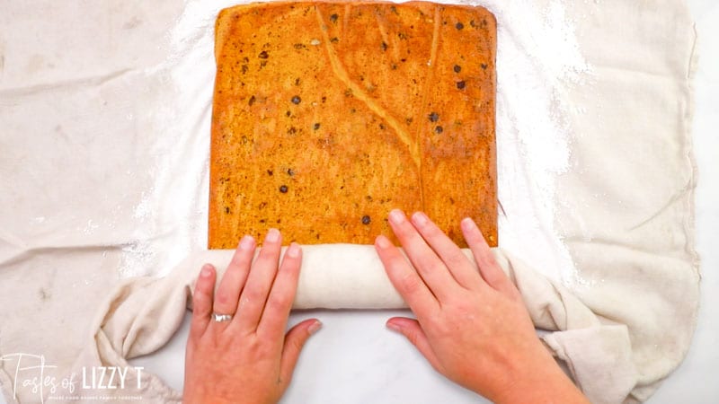 rolling a pumpkin cake roll