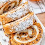 sliced Chocolate Pecan Pumpkin Roll on a plate