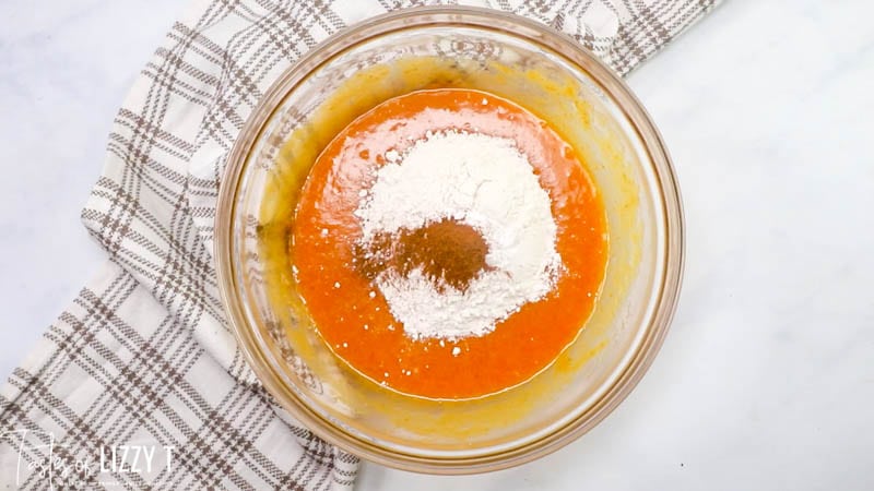 folding flour into pumpkin batter