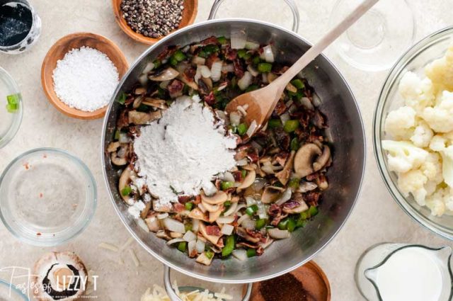 flour in a saucepan with vegetables