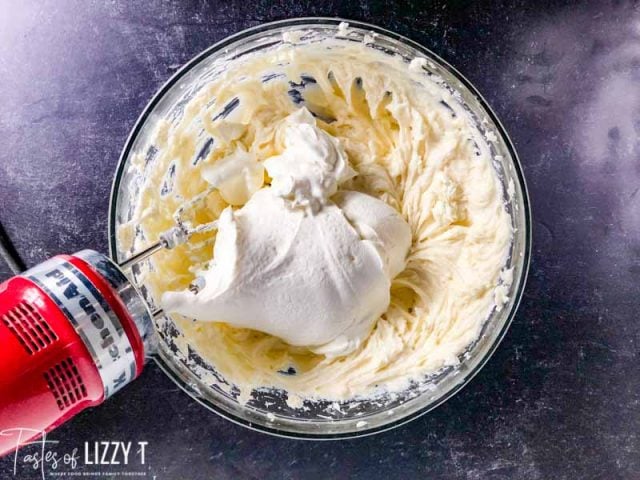 folding sour cream into cheesecake batter