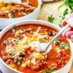 Beefy Mexican Rice Soup with a spoon